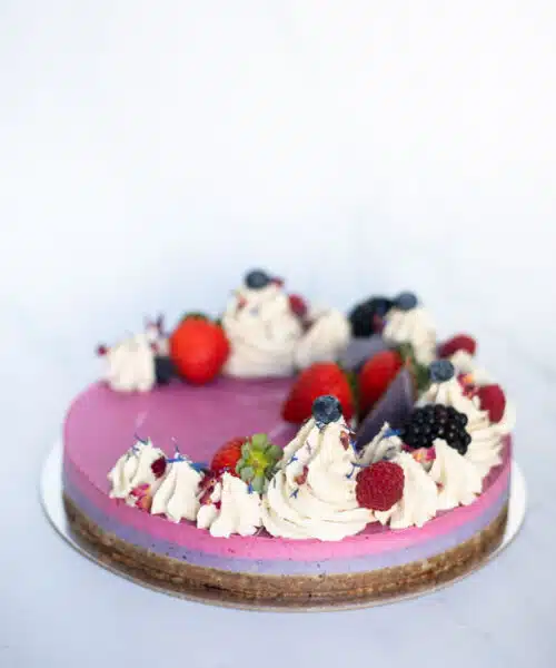 Raw Passion Berrylicious Cake with strawberry, blueberry & blackberry layers topped with vanilla icing