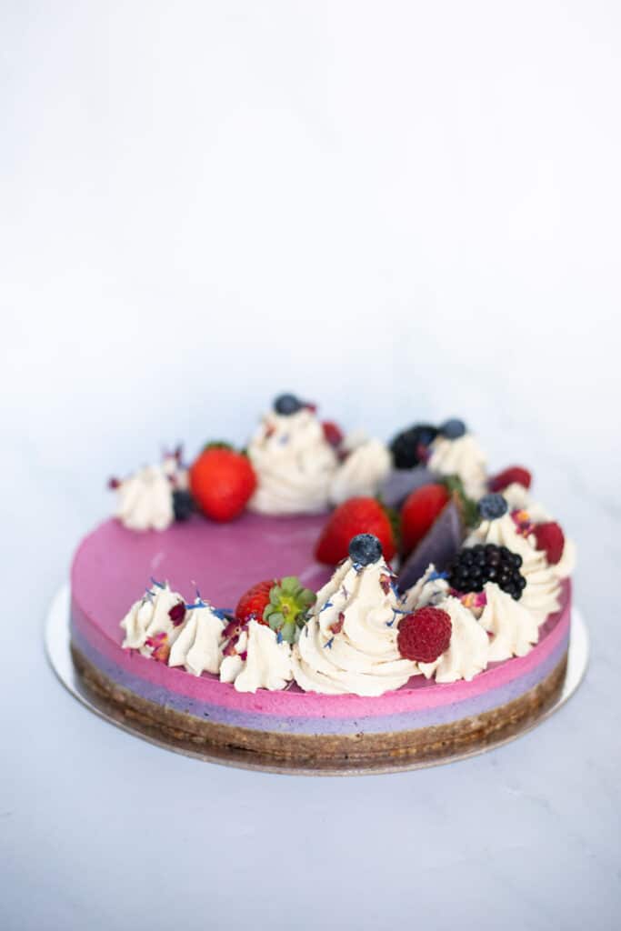 Raw Passion Berrylicious Cake with strawberry, blueberry & blackberry layers topped with vanilla icing